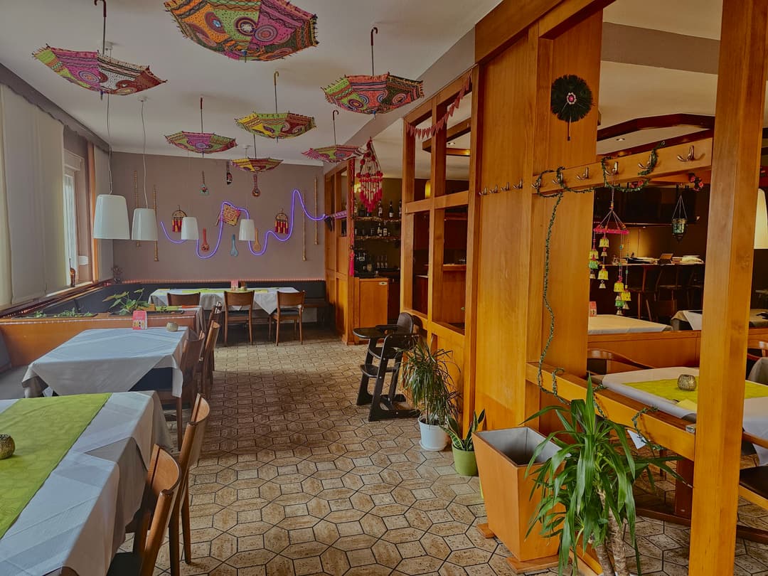 Cozy restaurant dining area with traditional Indian decor